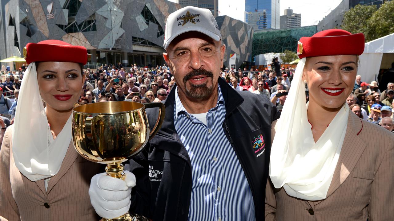 Melbourne Cup press conference featuring 2013 Emirates Melbourne Cup trainers and jockeys. A very confident Dr Marwan Koukash owner of Mount Athos holds the Cup after the Press conference.