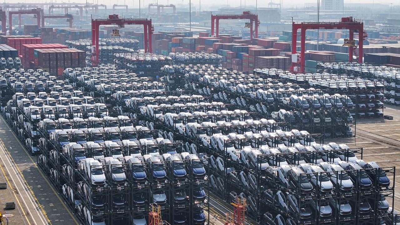 BYD electric cars waiting to be loaded onto a ship at the international container terminal of Taicang Port in Suzhou, in China. A sharp fall in lithium prices has reduced the cost of lithium-ion batteries, potentially increasing the adoption of EVs. Picture: AFP