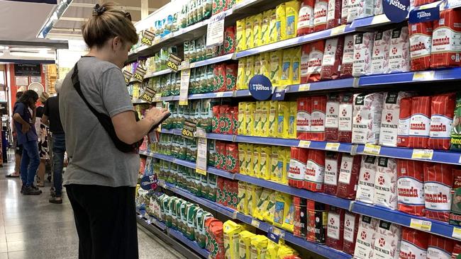 Monica Schenone, a member of the Movimiento a la Dignidad (Movement for Dignity) checks the prices of the Precios Justos program, at a supermarket in Buenos Aires. Picture: AFP