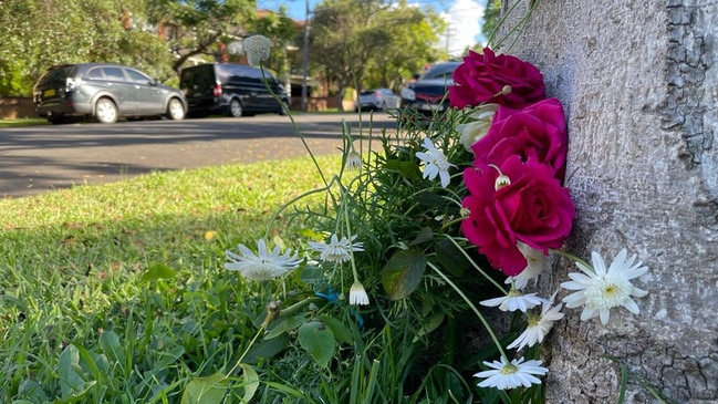 Flowers laid in memory of Thanh Long Le on Leylands Parade in Belmore.