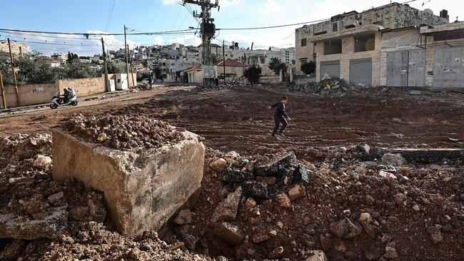 A Palestinian child plays on a damaged street following a three-day incursion by the Israeli army on the Jenin camp in the occupied West Bank bank city. Picture: AFP