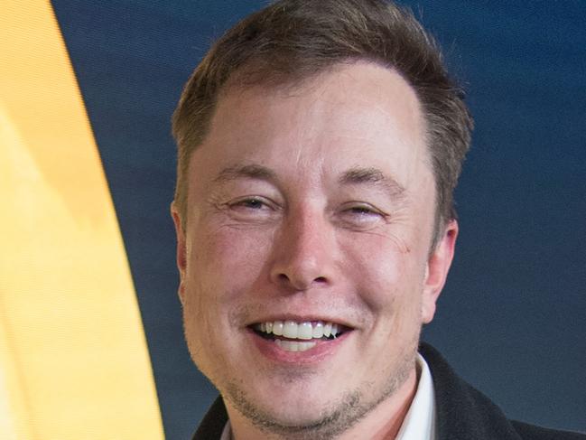 Elon Musk, CEO of Tesla and SpaceX, poses with his award during the 43rd 