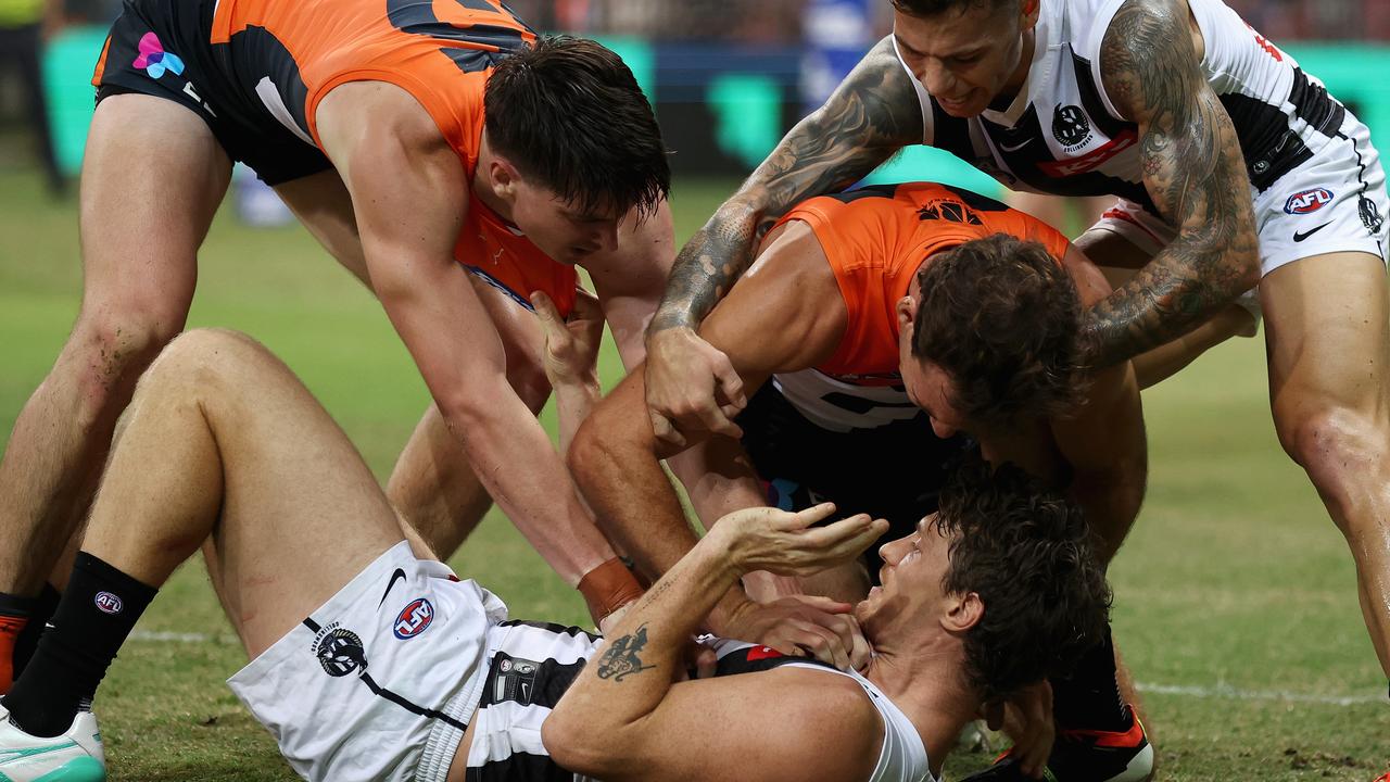 SYDNEY, AUSTRALIA - MARCH 09: Jack Buckley of the Giants and Brody Mihocek of the Magpies wrestle during the AFL Opening Round match between Greater Western Sydney Giants and Collingwood Magpies at GIANTS Stadium, on March 09, 2024, in Sydney, Australia. (Photo by Cameron Spencer/Getty Images)