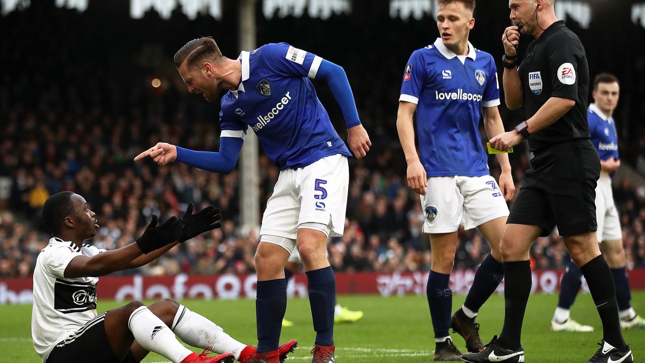 Jordan Lyden of Oldham Athletic argues with Neeskens Kebano of Fulham during the FA Cup Third Round