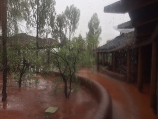 Flash flooding at Uluru has led to the closure of the national park. Picture: Parks Australia