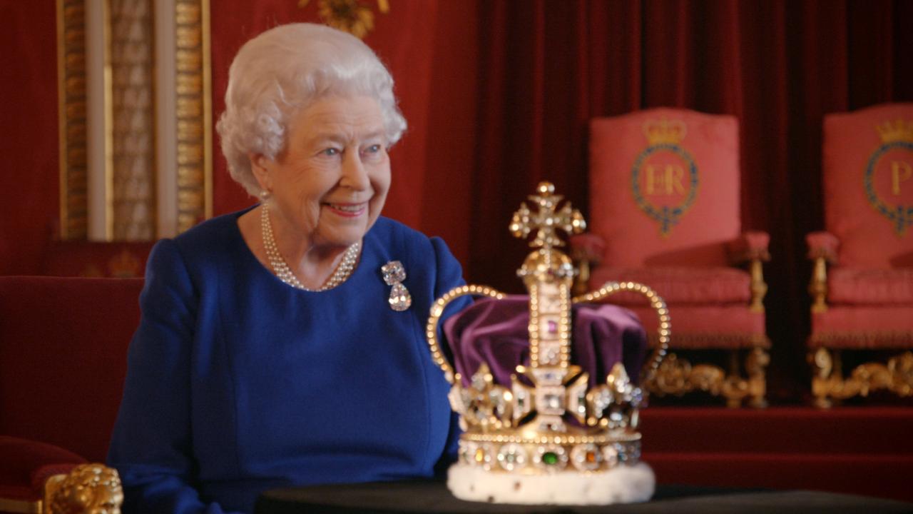 Queen Elizabeth II with the St Edward's Crown during a 2018 BBC documentary. The Coronation Crown Of England is made of solid gold. Picture: BBC