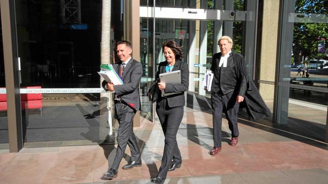 Esther Rockett (centre) leaves Sydney Supreme Court with solicitor Stewart O'Connell and barrister Tom Molomby after a December, 2018 hearing on an application for costs in the failed defamation case brought against her by Universal Medicine leader Serge Benhayon. Picture: Liana Turner