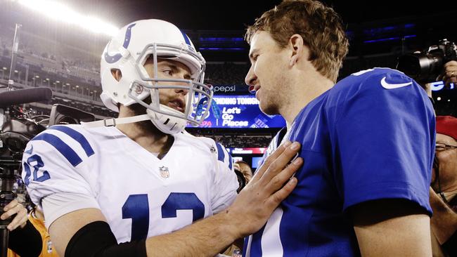 Indianapolis Colts quarterback Andrew Luck (12) and New York Giants' Eli Manning (10) talk after an NFL football game Monday, Nov. 3, 2014, in East Rutherford, N.J. The Colts won 40-24. (AP Photo/Kathy Willens)