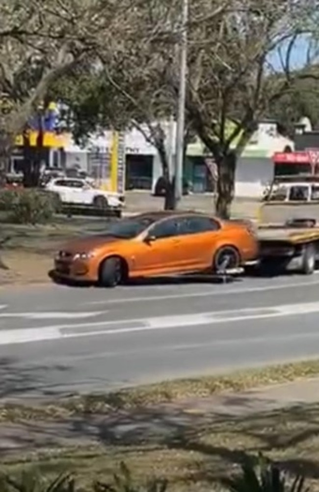 The Holden Commodore being taken away by a tow truck. Picture: Dennis Taunoa