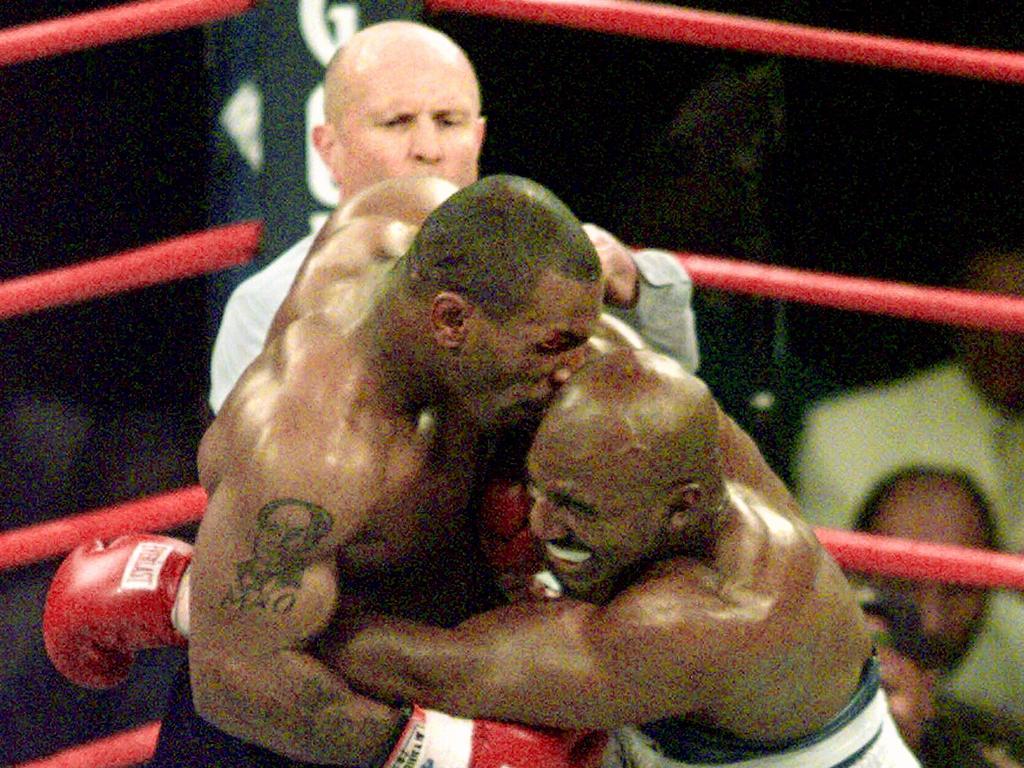 Boxer Mike Tyson bites the ear of Evander Holyfield during WBA Heavyweight match at the MGM Grand in Las Vegas, Nevada on June 28 1997.