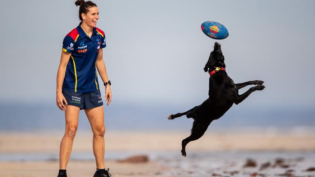 FUN AND GAMES: Chelsea Randall at the beach with her dog Koda. Picture: Matt Turner