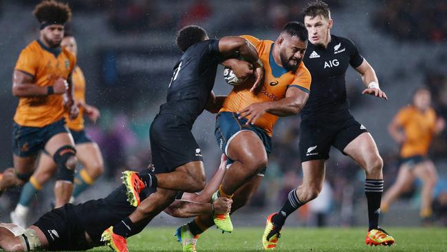 Taniela Tupou of the Wallabies is tackled by Sevu Reece of the All Blacks during The Rugby Championship and Bledisloe Cup match between the New Zealand All Blacks and the Australian Wallabies at Eden Park on August 14, 2021 in Auckland, New Zealand. (Photo by Anthony Au-Yeung/Getty Images)