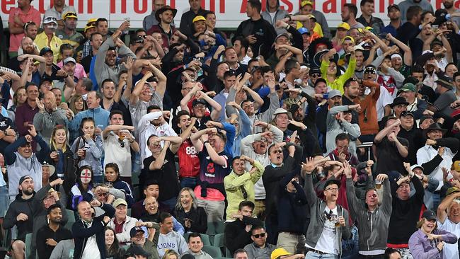 The Barmy Army mock Steve Smith by signalling a review during the Ashes. (AAP Image/Dave Hunt)