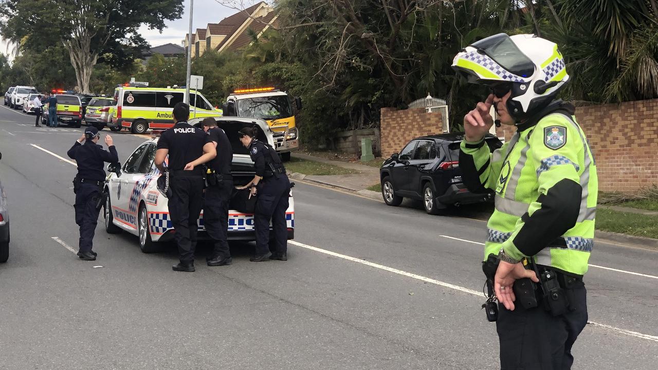 Police and other emergency services at Carindale where a man has been stabbed to death.