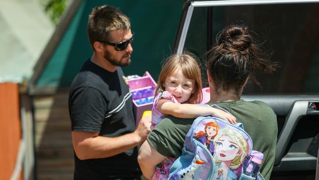 Cleo Smith is carried inside a friend's house by her mother. Picture: Getty