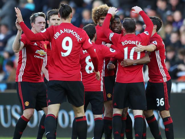 Manchester United's Paul Pogba, third from right, celebrates.