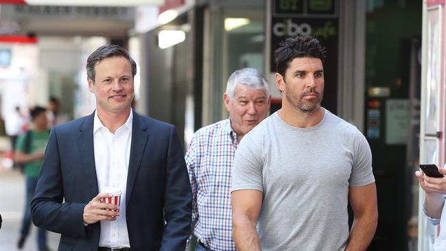 Manly Sea Eagles Chairman Scott Penn and Manly coach Trent Barrett entering Scott's North Sydney office. Picture: Brett Costello