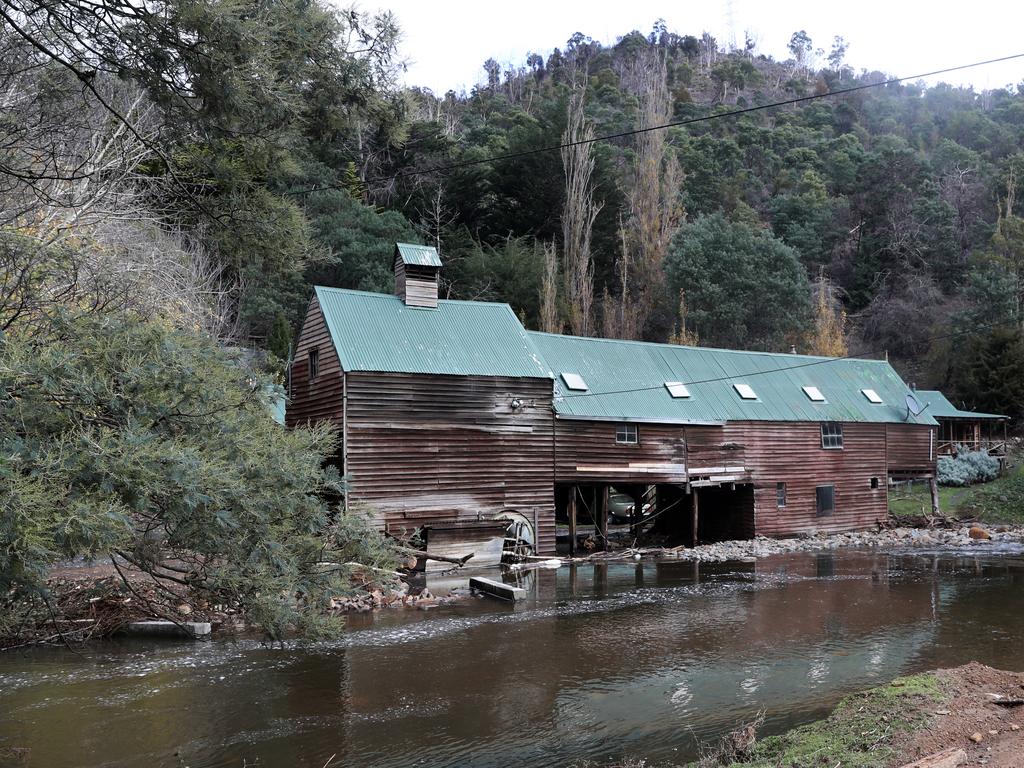 Flood water rushed past an old structure on Glen Dhu Road in Molesworth. Picture: LUKE BOWDEN