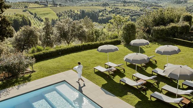 Como Castello del Nero’s pool with a view of the vineyards.