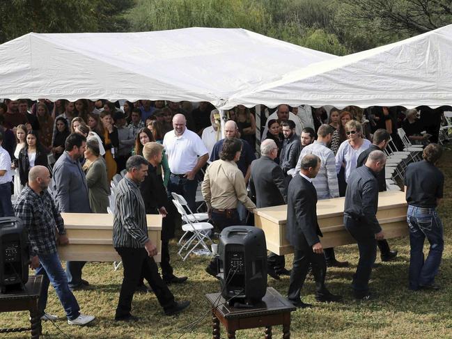 Men carry the remains of Dawna Ray Langford, 43, and her sons Trevor, 11, and Rogan, three at the cemetery in La Mora, Sonora state, Mexico. Picture: AP