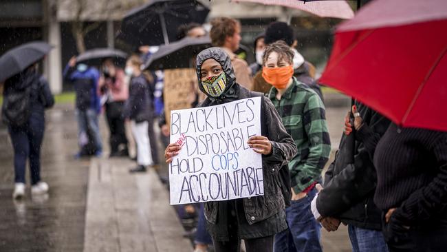 The Black Lives Matter protest in Adelaide in the rain on Saturday. Picture: Mike Burton