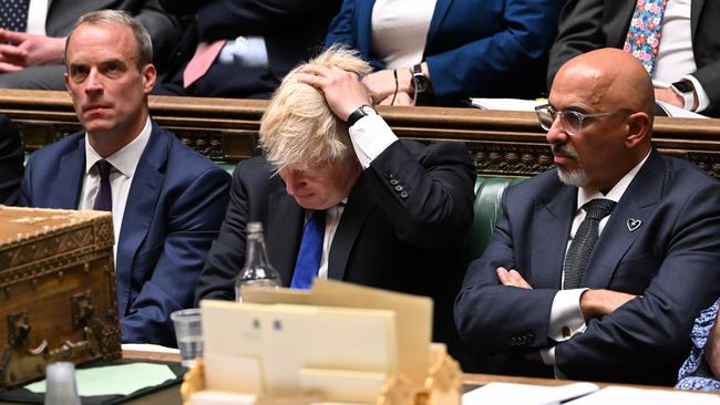 Boris Johnson (C) flanked by Britain's Justice Secretary and deputy Prime Minister Dominic Raab (L) and Britain's new Chancellor of the Exchequer Nadhim Zahawi (R) during prime minister's questions. Picture: AFP.