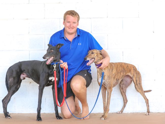 Leading Darwin greyhound trainer Steele Bolton with Porsche Monelli and Tom Tzouvelis’ Sunburst. Picture: Glenn Campbell