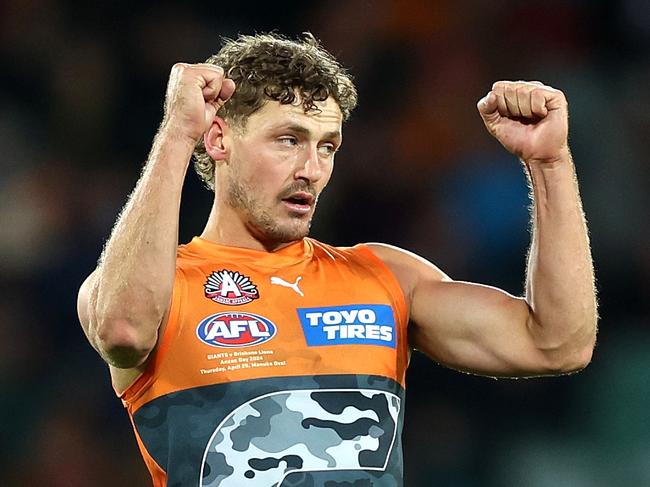 CANBERRA, AUSTRALIA - APRIL 25: Harry Perryman of the Giants celebrates kicking a goal during the round seven AFL match between Greater Western Sydney Giants and Brisbane Lions at Manuka Oval, on April 25, 2024, in Canberra, Australia. (Photo by Mark Metcalfe/AFL Photos/via Getty Images )