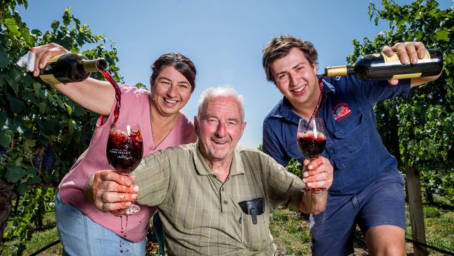 Linda Newton, Gino Corsini and Reuben Corsini enjoy the wine at La Cantina Winery. Picture: Jake Nowakowski