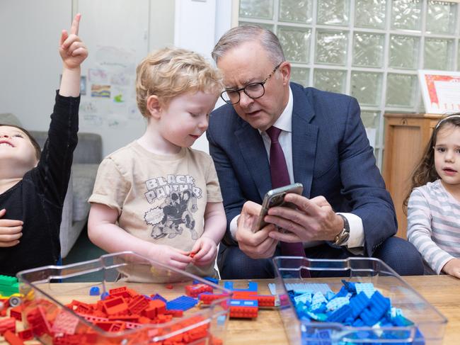 CANBERRA, AUSTRALIA - NewsWire Photos FEBRUARY 9, 2023: L-R: Bradley Gosper, Prime Minister, Anthony Albanese and Olivia Castrisson. The PM was showing Bradley his dog on his phone.Prime Minister, Anthony Albanese with the Minister for Education, Jason Clare, the Minister for Early Childhood Education, Dr Anne Aly and Alicia Payne, the Member for Canberra during a visit to the Manuka Childcare Centre.Picture: NCA NewsWire / Gary Ramage