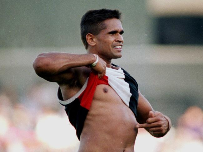 Nicky Winmar lifts his jumper and points to the colour of his skin to the Collingwood supporters at Victoria Park. He had been racially abused by the Collingwood crowd for being an aboriginal. The Saints won the match. St Kilda v Collingwood. 18/04/1993. Pic John Feder