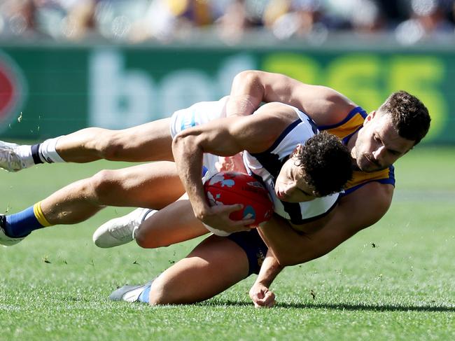 ADELAIDE, AUSTRALIA - APRIL 16: Tyson Stengle of the Cats is tackled by Josh Rotham of the Eagles during the 2023 AFL Round 05 match between the Geelong Cats and the West Coast Eagles at Adelaide Oval on April 16, 2023 in Adelaide, Australia. (Photo by James Elsby/AFL Photos via Getty Images)