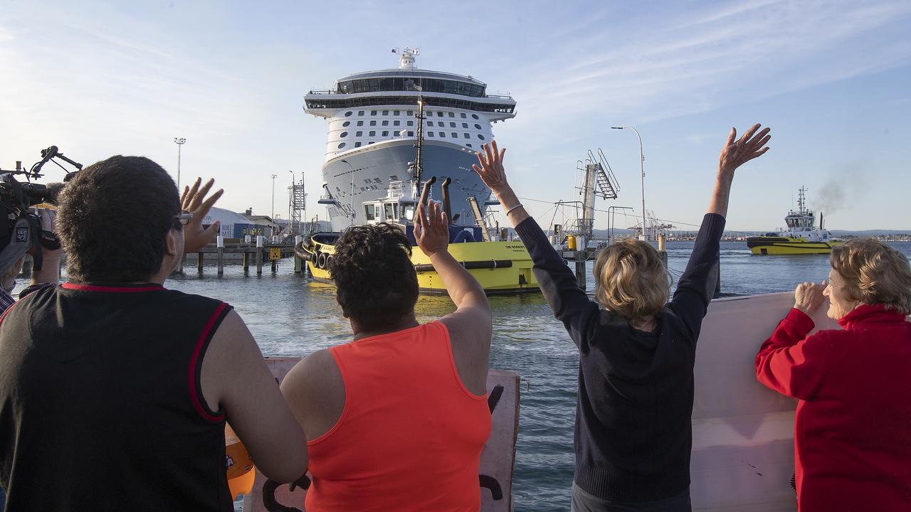Locals gather to wave off the Ovation of the Seas cruise ship, which carried passengers who travelled to White Island when it erupted. Picture: John Boren/Getty Images.