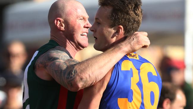 Barry Hall gets up close and personal with an opponent. Picture: Stuart Milligan