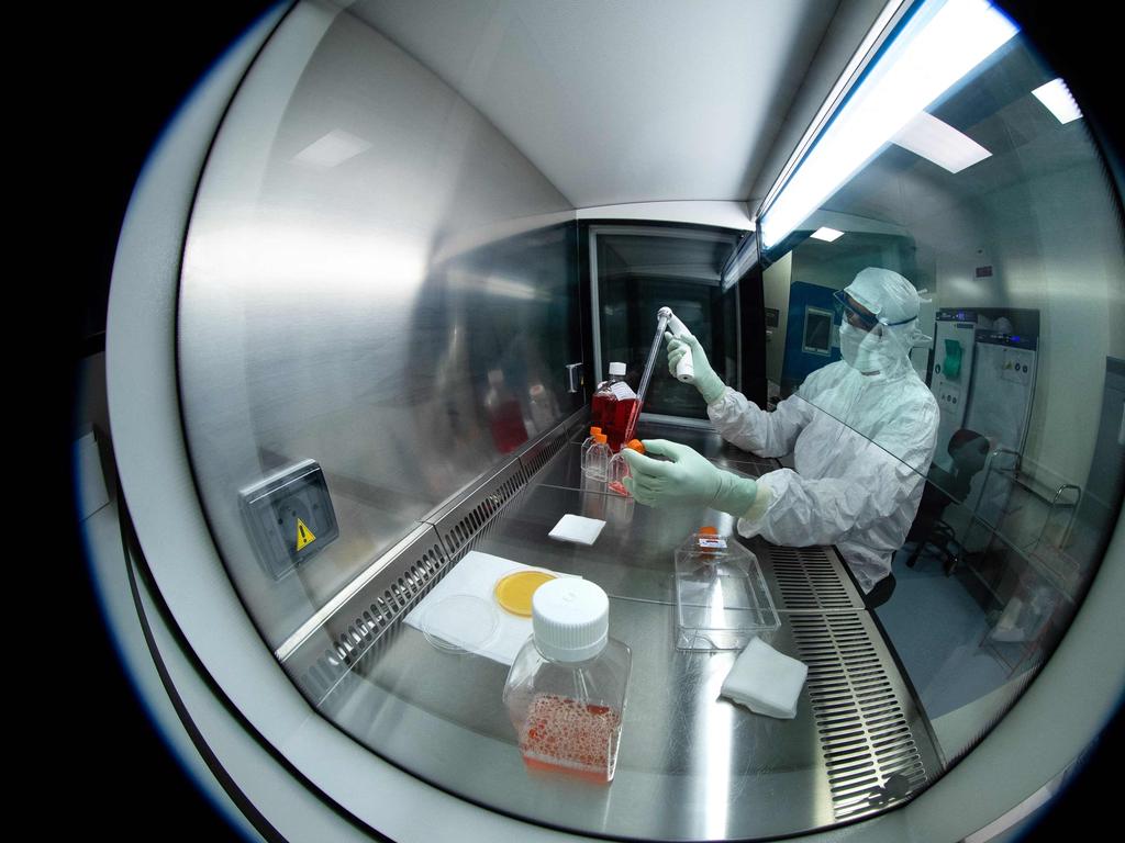 (A medical technician works on the Johnson &amp; Johnson vaccine. Picture: AFP