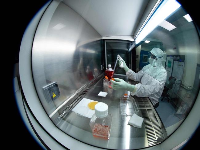 (A medical technician works on the Johnson & Johnson vaccine. Picture: AFP