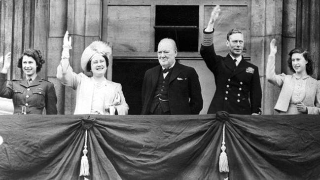 Winston Churchill is the centre of attention as Britain celebrates VE Day in May 1945. The statesman suffered defeat at the general election in July. Picture: AP