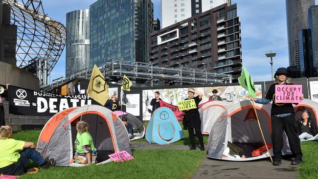 Other protesters held signs and set up tents on the outside of the building. Picture: Nicki Connolly