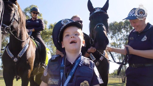 Young Travis Heery enjoys his day as an honorary police officer