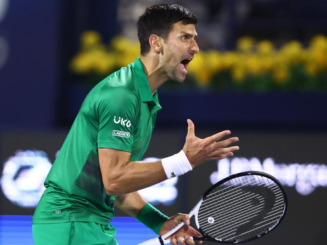 DUBAI, UNITED ARAB EMIRATES - FEBRUARY 21: Novak Djokovic of Serbia reacts during his Men's singles match against Lorenzo Musetti of Italy on day eight of the Dubai Duty Free Tennis at Dubai Duty Free Tennis Stadium on February 21, 2022 in Dubai, United Arab Emirates. (Photo by Francois Nel/Getty Images)