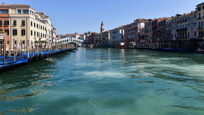 Clear waters of the Grand Canal in Venice as a result of the suspension of motorboat traffic, shed new light on the environmental damage caused by transport. Picture: Andrea Pattaro/AFP