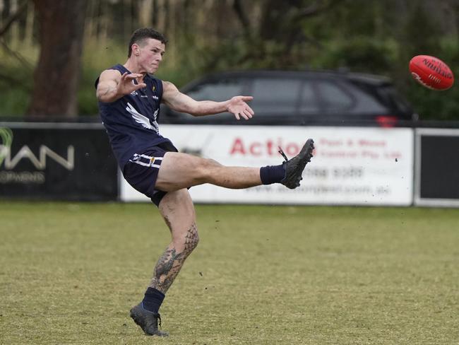 Nick Carlon takes a kick.