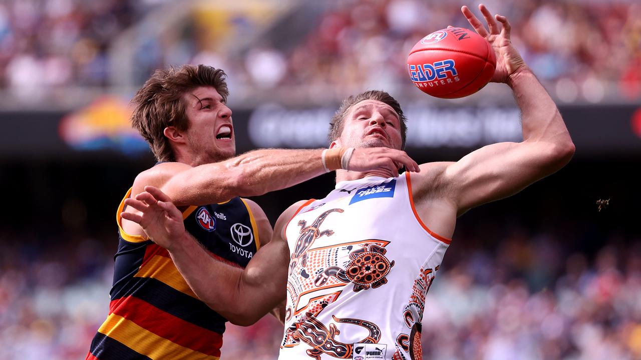 Jordon Butts and Jesse Hogan in last year’s clash. Picture: James Elsby/AFL Photos