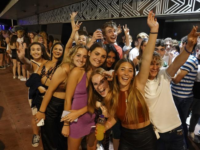 BRIGHTON, ENGLAND - JULY 18: Clubbers queue around the block at a few minutes to midnight waiting for Covid-19 restrictions to be dropped and for Pryzm nightclub to open its doors once more on July 18, 2021 in Brighton, England. At a minute past midnight, England dropped most of its remaining Covid-19 social restrictions, such as those requiring indoor mask-wearing and limits on group gatherings. These changes come despite rising infections, pitting the country's vaccination programme against the virus's more contagious Delta variant. (Photo by Chris Eades/Getty Images)