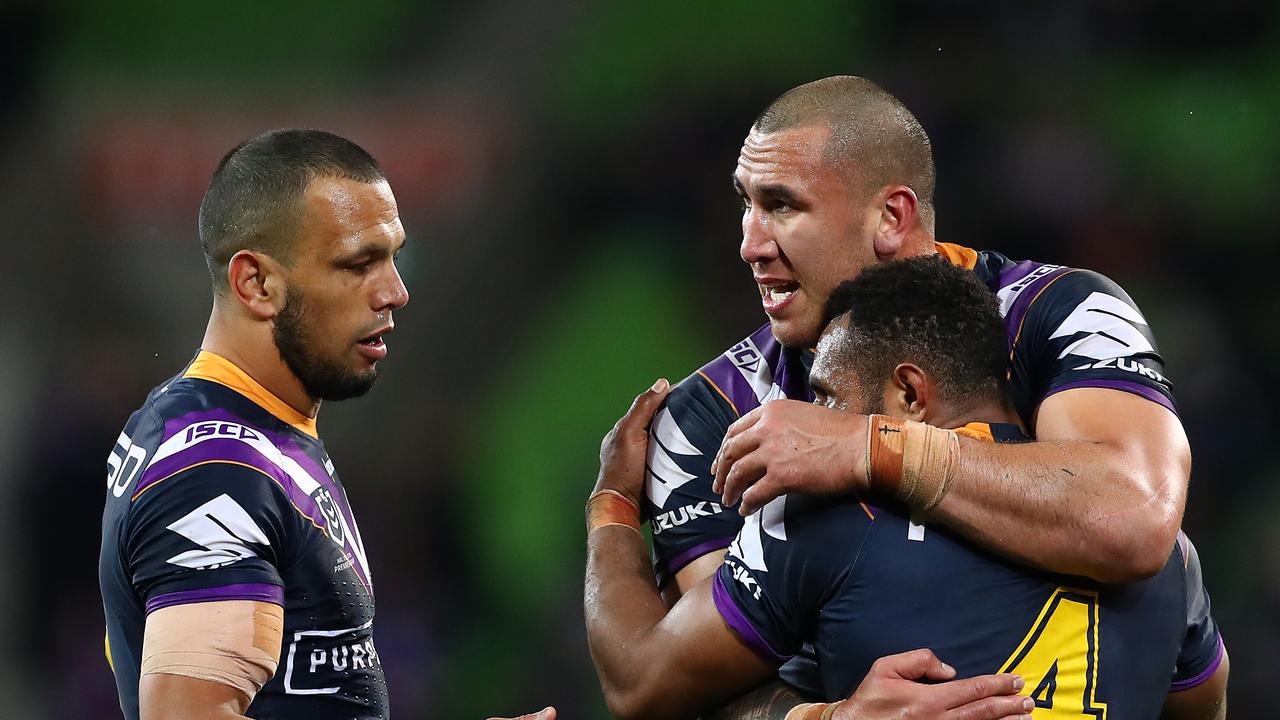 Nelson Asofa-Solomona of the Storm celebrates his try with Justin Olam and Will Chambers