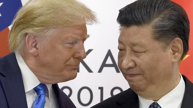 FILE - U.S. President Donald Trump, left, meets with Chinese President Xi Jinping during a meeting on the sidelines of the G-20 summit in Osaka, Japan,  June 29, 2019. (AP Photo/Susan Walsh, File)
