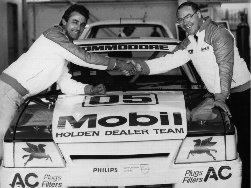 Drivers Peter Brock and Allan Moffatt with 1986 V8 Holden Commodore car. Picture: Supplied