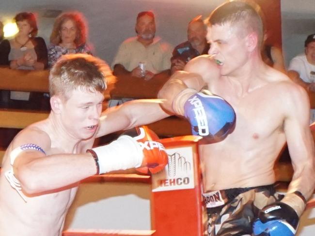 KNEES OF FURY 58 - Stephen Legierski knocks Cameron Bulley down to the canvas in Round 2. Photo: Adam Orlowski