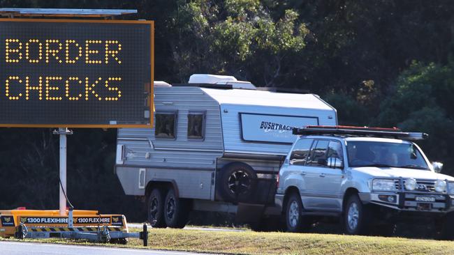 Warnings signs greet motorists at the border between Qld and NSW at Tweeds Heads. Picture Glenn Hampson