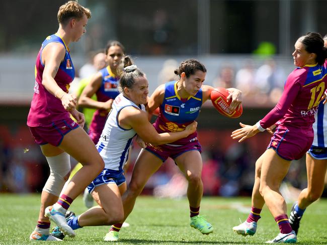 MELBOURNE, AUSTRALIA - DECEMBER 03: Ally Anderson of the Lions is tackled by Emma Kearney of the Kangaroos during the AFLW Grand Final match between North Melbourne Tasmania Kangaroos and Brisbane Lions at Ikon Park, on December 03, 2023, in Melbourne, Australia. (Photo by Josh Chadwick/AFL Photos/via Getty Images)